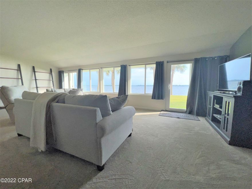 CURRENTLY UNDER CONTRACT, SELLER ACCEPTING BACKUP OFFERS................What a rare opportunity with this first floor 3-bedroom 2 bath split floorplan at the Cove Condo. Completely gutted to the studs and updated with new electric, floors, windows, doors, kitchen and baths. Absolutely great views plus access to the back lawn for the pets or your afternoon fun. The complex offers community room, swimming pool and boat dock.