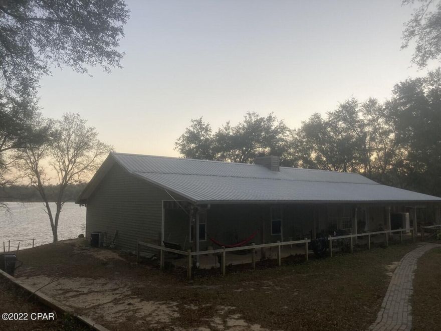 Come check out this waterfront Ranch style home in the back of Grassy Pond Ranch, A tight knitted community in Chipley. This 5 bedroom 4 bathroom 2464 SQ FT home is perfect for a large family who loves the outdoors. Two covered carports provide plenty of parking spaces for a large family with potential to enclose for large workshop. The back deck provides unobstructed views of the lake.