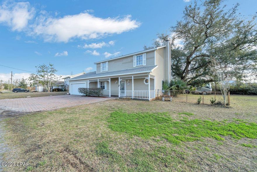 This country style home offers over a half acre lot, coveted 2 car garage, plus detached workshop/ mancave in the backyard. As you enter the home from the inviting front porch there's a large living room with wood flooring for cozy evenings in front of the wood-burning fireplace. The separate dining room is tailor-made for entertaining, family gatherings and holiday celebrations. An additional family room offers practical tile floors and a wall of useful bookshelves and storage. The kitchen has a full range of cabinets and stainless appliances and a first floor utility room just off the 2 car garage. Head upstairs to find three generous bedrooms and two full baths with generous closet space.  This family home has huge potential and with a little TLC could be returned to its former glory. With the added advantage of no HOA, this spacious home could be a real gem.