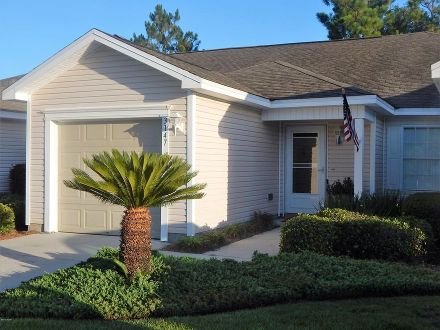 Immaculate Townhome in desirable Hammocks subdivision. This 2 bedroom/2bath home is move in ready. Home has been freshly painted and features open floor plan with vaulted ceiling, brand new carpet, large kitchen with lots of cabinets and breakfast bar. His and her closets in master bedroom, large master bath with double vanity. Screened in back porch. Single car garage. HOA includes community pool and ground keeping which allows you to relax while someone else does the work for you. Centrally located near schools, shopping and restaurants.