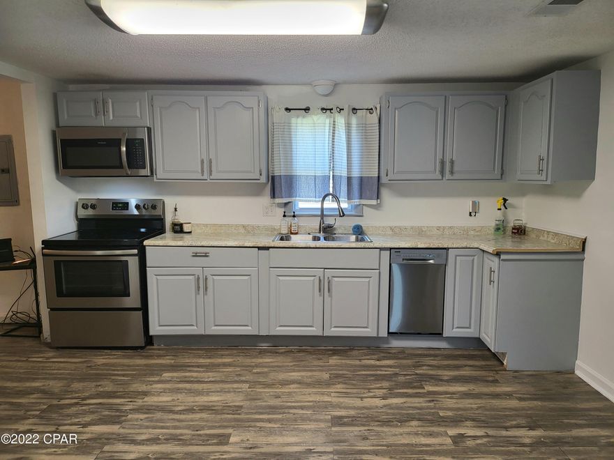 This beautiful home is move in ready!  It is absolultely adorable with luxury vinyl plank floors in the kitchen/bathrooms and carpet in the living room and bedrooms.  It has a spacious kitchen with stainless appliances.  You'll love the front porch and the private feel.  It is not far from town but has a country feel.  This is the best deal around so call for a tour before it's too late.