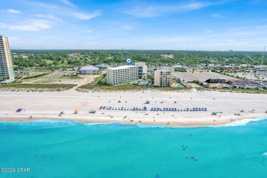 Ground-Floor Beachfront Gem at PCB's Favorite Family Resort — Beachfront Unit Under $250K!

Welcome to one of Panama City Beach's most popular family-friendly resorts. This beautifully renovated ground-floor studio offers the ultimate in convenience and coastal living—no elevators, no stairs, no hassle. Simply park and walk directly into your fully updated unit, making it ideal for families with young children or guests seeking easy, step-free access.

Fully renovated in 2022, this coastal retreat features stylish tile flooring, stainless steel appliances including a dishwasher and refrigerator, crisp white cabinetry, updated lighting, charming barn doors, a large ceiling fan, and a sleek fiberglass shower. The bathroom is finished with a granite vanity, and the entire unit is tastefully styled with fresh, modern coastal décor.

Step outside to your private patio and picnic area, perfect for morning coffee, casual meals, or unwinding after a day at the beach. Enjoy seamless indoor-outdoor living with quick access to the pool and the sugar-white sands just steps away.

The resort offers lushly landscaped grounds, a large beachfront pool, poolside concessions, 24/7 security, and an active, well-managed HOA. Ideally located on highly sought-after Thomas Drive, you're just minutes from Panama City Beach's best dining, shopping, golf, and attractions.

This unit also presents an excellent turnkey investment opportunity, with a proven rental history since 2022. All current reservations convey, allowing you to start generating income immediately.

Don't miss this rare opportunity to own a pristine, ground-floor beachfront unit at an exceptional value—schedule your private showing today and secure your place in paradise.