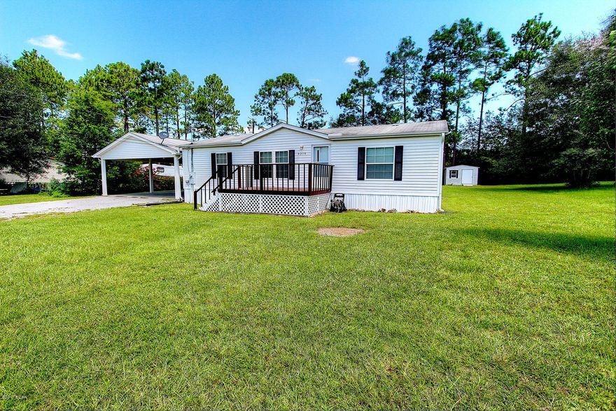 Lovely 3 bedroom 2 bath home located on a large almost 1/2 acre lot. Home in immaculate condition, very well maintained. Vaulted ceiling in living area, Dining area has French doors leading out onto a huge covered 14x20 wooden deck, 8x14 front porch, double heavy duty carport, 24x24, for parking your car or boat with attached 20x24 his & hers double shop, large master suite and master bath with double vanity. Water heater is new, installed in January. Seller offering a 1 year home warranty protection plan!!!