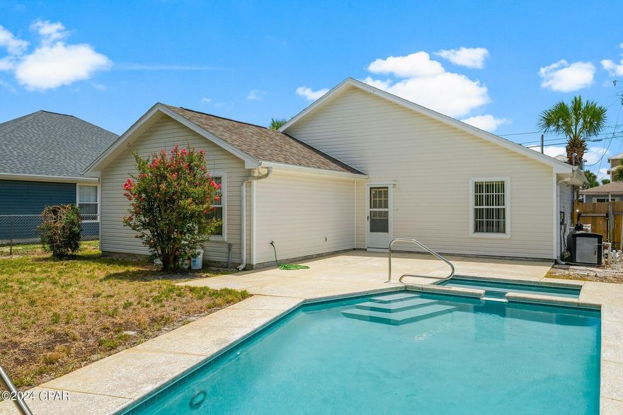 'CURRENTLY UNDER CONTRACT, SELLER WILL CONSIDER BACKUP OFFERS'
Welcome to your perfect primary home, vacation home or short-term rental opportunity! This delightful 3-bedroom, 2-bathroom home is located just a few blocks from the closest beach access, offering the ultimate coastal living experience, with only one previous owner!

Step inside to find a welcoming main living space with a pitched ceiling, providing an airy and spacious feel. The home features a mix of tile and carpet flooring throughout, adding both style and comfort.

Enjoy the Florida sunshine in your private backyard oasis, complete with an in-ground pool and hot tub combo. Perfect for relaxing after a day at the beach!

This property includes a 1-car garage and comes partially furnished, making it a turnkey solution for your vacation needs. 

This home is conveniently located off of Thomas Drive, close to restaurants, shops, beaches, and activities to do with the family!

Don't miss out on this charming beachside retreat!