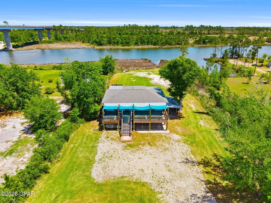 Welcome to your slice of waterfront paradise on the Intercoastal Waterway! This beautifully designed 3-bedroom, 2-bathroom home offers the perfect blend of comfort, natural light, and breathtaking views.
Step inside to a bright and airy living space filled with tons of natural lighting, enhanced by light hard wood flooring that creates a warm and inviting coastal feel. A double set of large sliding glass doors draws your eyes straight to the water, seamlessly blending indoor and outdoor living while showcasing stunning, unobstructed views of the Intercoastal.
The kitchen is both stylish and functional, featuring light wood cabinetry, bright countertops, and a spacious walk-in pantry--perfect for keeping everything organized while maintaining the home's clean, coastal aesthetic.
Enjoy morning coffee or evening sunsets from not one, but two spacious decks--perfect for entertaining guests, relaxing with family, or simply soaking in the peaceful waterfront setting.
The master suite is a private retreat featuring its own ensuite bathroom with a double vanity, walk-in closet, and serene views. Two additional bedrooms offer flexibility for guest accommodations, a home office, or hobby space.
Downstairs is a blank canvases with two large open spaces that can be finished out or left open for a game room, a workshop or what ever your heart desires. 
with the HVAC and water heater just a few years old, updated plumbing and electrical through out most of the house this home is low maintained and turn key. 

Whether you're looking for a full-time residence, vacation home, or investment opportunity, this waterfront gem delivers the lifestyle you've been dreaming of. Don't miss your chance to own a piece of the Intercoastal!