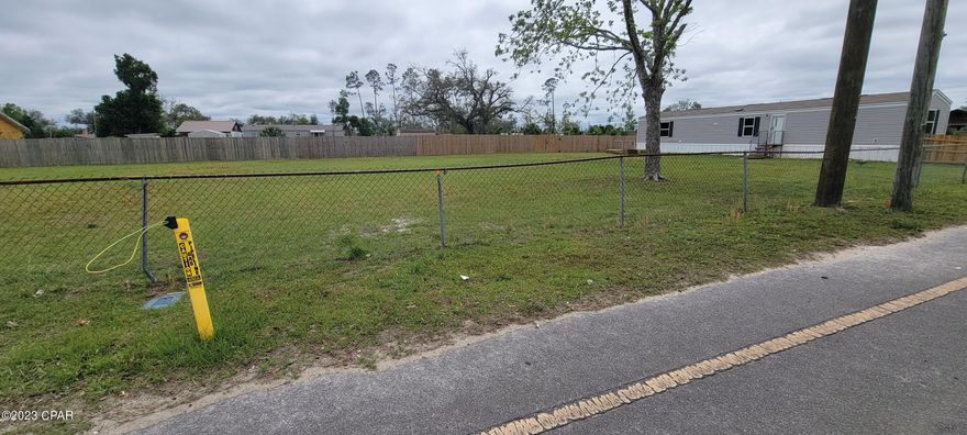 A spectacular main street lot right down the road from a public boat ramp  with gulf access. There is also a brand new park being built at the boat ramp location. Tyndall , Walmart , fine dining are only min away . Call your agent today and make an offer. MOBILE HOME FRIENDLY
