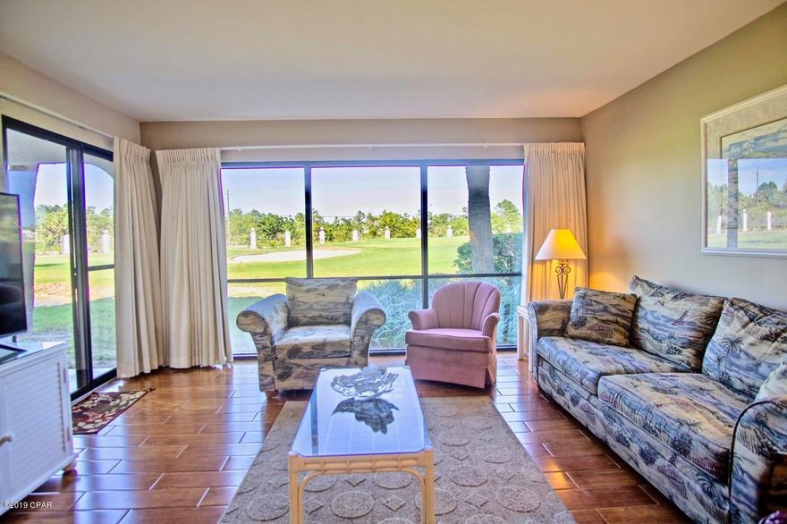 Spacious end unit on the fifth hole! This well kept condo comes fully furnished and rental ready for you to enjoy the white sandy beaches and lush tropical pools that Edgewater Resort is known for. Oversized window in the living room showcases sweeping views of the golf course and ponds around this beautiful condo. Large rooms and plenty of closet space in this well laid out condo. New wood plank tile in the living room and dining room is warm and inviting. Hot water heater is 2 months old and A/C unit was replaced 3 and a half years ago.  Close to shopping, dining and the areas entertainment venues. On-site restaurant, tennis courts, golf, pro shop makes this resort a true tropical, gulf front getaway.