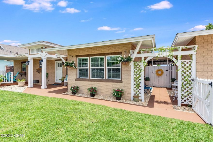MUST-SEE STUNNING BEACH HOME on DOUBLE LOT in the desirable El Centro Beach neighborhood! Walk to the beach or take a short golf cart ride to Pier Park from this beautiful Craftsman-style home! Designed for indoor/outdoor living, come home, and relax on the covered front porch, in the quiet breezeway, on the private back patio, or the oversized deck built for entertaining. Extra-large privately fenced backyard with new Zoysia sod provides space to park a boat or RV, add a pool, build a playground, plant a garden, or let the pets run free! Updates throughout the home include new paint, appliances, commercial grade hot water heater, lighting, window treatments and more. The large eat-in kitchen includes a new Whirlpool appliance package and Bosch dishwasher. The laundry room is equipped with Whirlpool front load HE washer and dryer and utility sink with cabinets. Great room includes a bar, electric fireplace, and 70'' Vizio TV. Split floor plan with en suite baths in two bedrooms. Second and third bedrooms include oversized closets. All bathrooms have been updated. Conveniently located close to Highway 79 and Panama City Beach Parkway with quick access to shops, restaurants, grocery, sports, and entertainment! With NO HOA, this home is the TOTAL PACKAGE! PRICED TO SELL! Furniture & décor available outside of escrow.