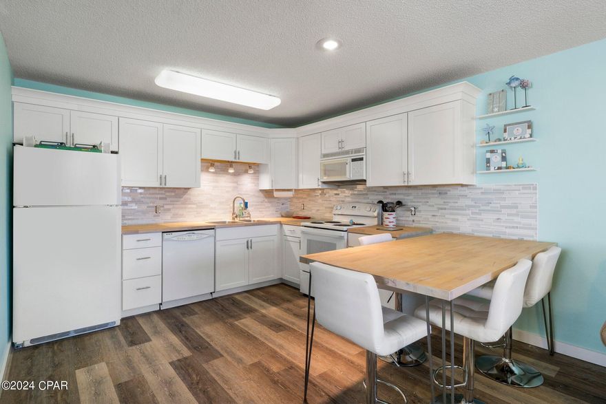 Discover your Horizon South haven in Panama City Beach! This ground-floor unit is bathed in Florida sunshine, showcasing LVP floors, a modern kitchen with butcher block countertops, and hallway bunks. Relax on your private patio, centrally located for easy beach and pool access. Enjoy resort living with multiple pools, tennis courts, mini-golf, and more. An ideal investment, perfect for short-term rentals or weekend escapes. This meticulously maintained condo offers both convenience and coastal charm—your gateway to the Horizon South lifestyle!

Owner has never rented.  Rental projections between $21-35k.