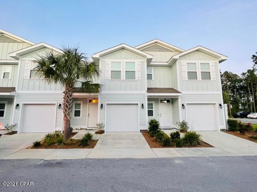 Beautiful newer townhome centrally located near Panama City Beach. This home is near the entrance to Waterfall Community easily accessing the pool house, community center, and other amenities. It is minutes away from great shopping, great schools, phenomenal dining, and much more. This home offers Bisque cabinetry, Galio Fiesta granite tops, luxury vinyl plank flooring, Smart technology, 9' Ceilings on the first floor, and 8' Ceilings on the second floor. Master Suite includes large walk-in closet, and double vanities in Master bath. Entire Waterfall community is surrounded by conservation  land and just 1.3 miles from beach access. Stainless appliances include refrigerator/washer/ dryer. Call and schedule your opportunity to come check out this magnificent property before its too late.