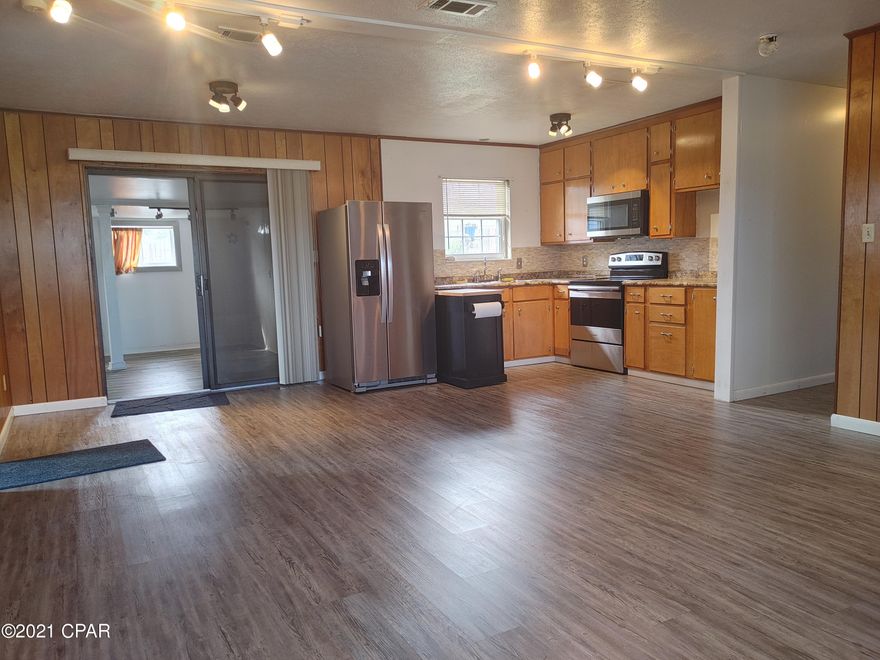 Back on Market,  all repairs were completed. roof  permitted, redone Aug. 2021, This family neighborhood is were you need to be, close to shopping and schools, 3 bedrooms 2 baths, and a Bonus Room that could be a 4th bedroom or use as a family room, Bonus room  square footage not included, Seller had a portable  unit for heating and cooling).. Walk in Laundry Room, New stainless steel appliances, vinyl plank floors, new carpet in Bedrooms, ceiling fans, track lighting.  electrical wiring updated May 2021,  2 carports,  large back yard. 

Utility Shed, privacy fenced,