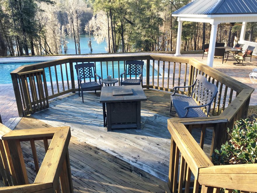 Beautiful WATERFRONT HOME on Merritts Mill Pond and in Indian Springs Sub. This home has new porcelain and hardwood flooring throughout and looks awesome, 9 foot ceilings, A lot of Glass across the back of the home offers views looking out over the Deck, Saltwater Pool and the Spring fed, Merritts Mill Pond. The home also has a bonus room that can be used as a Formal Dining, office or TV room as it is used right now. The bedroom arrangement is the Split floor plan with the master suite located privately to itself. The Master Bath has a very nice walk in shower, make up vanity and more. The rear of the home is set up for entertaining with multi level decks, Gazebo, salt water pool and the view all the way to the crystal clear water. These are the original owners of the home.