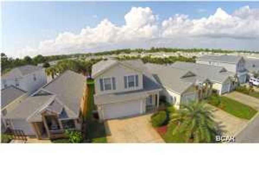 Well maintained subdivision, convenient to shopping and the world famous sugar sand beaches. Palm Cove is in the heart of the beach and only 1 1/2 miles to Pier Park. Convenient to fabulous restaurants and even the Trolly stops in front for a ride. Local schools are close by with bus service into the subdivision. HOA fee included, 2 swimming pools, pavilion, private streets with security after dark. Lawn maintenance is included and so is garbage pick up. Truly a great home. There are only 12 of this model out of 366 homes and is the largest home in Palm Cove. Features the only 2 car garage.