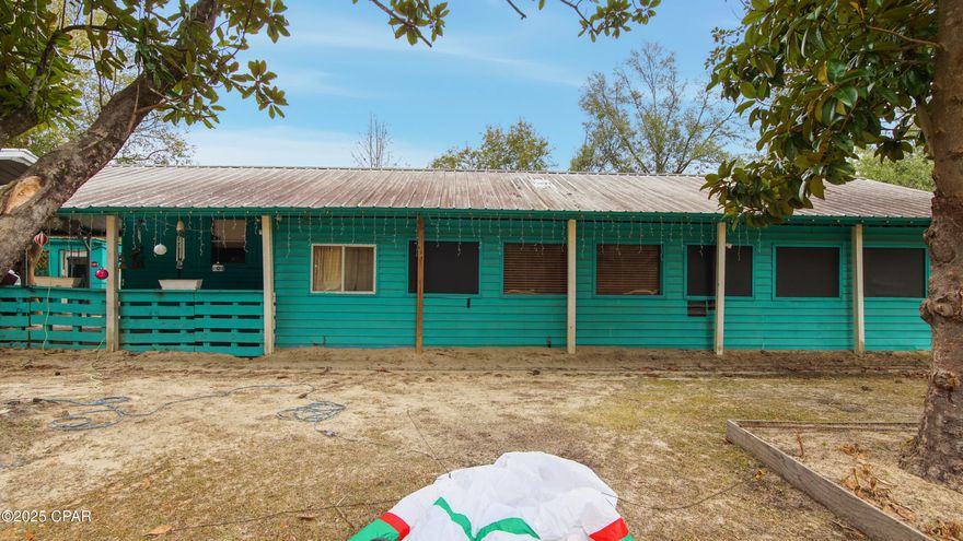 Investment property! This 2Br/1Ba home is perfect for someone looking to downsize, for a starter home, or a rental investment. Nestled on a 1/2 acre lot, there is plenty of room between you and your neighbors. Lots of privacy. The Florida Room is heated & cooled for an extra 320sf of living space! Located only 35 minutes from shopping, dining, and the world's most beautiful beaches, this home is priced to sell so make your appointment today!