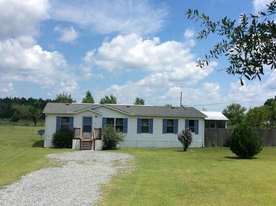 Want to live in the country , yet no dirt roads. You will love this place , its out of town ,yet close to town. This 3 bedroom and 2 bath doublewide home has large living area and roomie kitchen . Split floor plan and a great screened in back porch. Front yard has lots of flowers and shade trees too. The fenced back yard offers several type peach trees and other flowering trees and plants. A 36x24 work shop with roll up door and entry door. Shop has heat and air unit , sink with running water and cement floor. Home has a new hot water heater 2015 , new roof 2010 and a/c in 2010.Nice place to call home. Call today for your appointment.