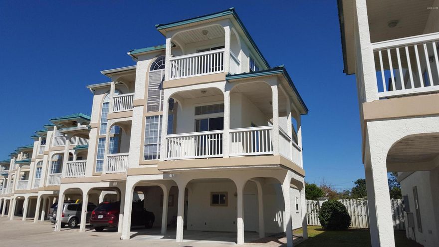 Duplex unit w/self contained lockout on first floor. Panoramic Gulf views and clear access to the nearby beach is located just across the street. The Master Suite with tray ceiling encompasses the entire third floor and includes a Jacuzzi tub, large sitting room area, private deck, three ceiling fans and a floor to ceiling Palladian window for fabulous gulf and west facing sunset views. There is also a huge walk in closet. The second floor contains the fully equipped kitchen with Granite counters, breakfast bar seating six, large pantry with shelves, and laundry room. The great room features crown molding, two ceiling fans, and abundant natural light. The large wrap around deck with an outdoor ceiling fan is accessed from either the French doors or the patio door. The guest bedroom overlooks the private wooded backyard. A full bath and walk in closet with shelving completes the space. The first floor lockout suite features a full kitchen, pantry with shelves, bath and private patio backing up to a wooded backyard. There is covered parking for two cars. The Palms is a small complex, not far from Pier Park, providing a pool, sauna, hot tub and picnic area. All square footage and measurements are approximate. schools, square and any other information deemed important to Buyer should be verified.