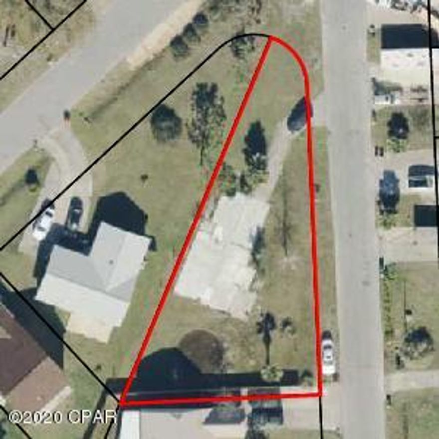 Large, triangular corner lot with power, gas and plumbing hookups on site.  The slab is still there, but the house has been taken down.  Good neighborhood to build your new home, close to Tyndall Air Force Base.