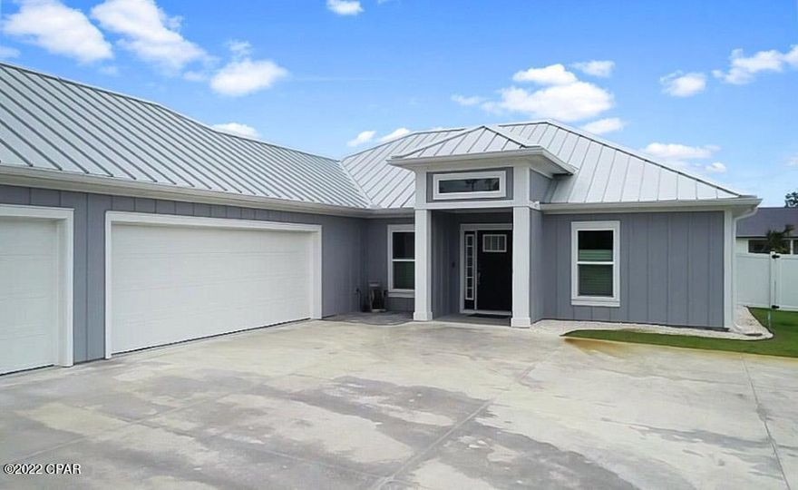 WELL APPOINTED 3BR/2.5BA CUSTOM FLORIDA HOME IN THE GOLF CART FRIENDLY COMMUNITY OF SEA HAVEN! Vaulted ceilings & classic LVP flooring invite you in to an open concept design. Newly constructed in 2020 w/modern amenities to include a gas range, wine fridge & breakfast bar seating. Extend your entertainment space to the covered back porch & paver designed patio w/lounge area, hot tub & 1/2 BA. Sliding barn doors & shiplap walls accent the primary suite featuring a tile walk in shower & granite top double vanity. Apart from the primary is an office space, extra BD & shared hall BA. Two attached garages can fit up to 4 vehicles or use the adapted heated/cooled SQ FT as a recreation room or workshop. Just a few blocks away are pet friendly white sand beaches & the Gulf of Mexico. Don't delay!