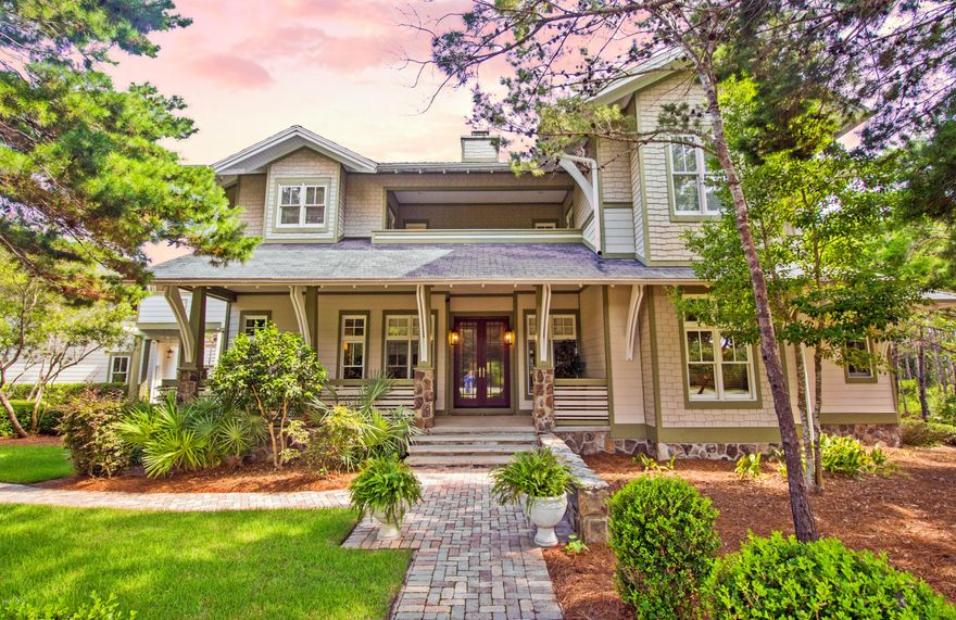 This exceptional Coastal Living featured home offers all the charm of a cottage and features all of the luxurious amenities of an upscale executive home. This amazing home provides Smart House technology including an Ecostar 50 year warranty, slate-look roof, Rinnai gas water heater and Icynene foam insulation. When you walk in the front door of this 4 bedroom 4.5 bath masterpiece you are greeted by a natural stone double-sided gas fireplace that separates the slate and paneled foyer from the main area of the home. The other side of the fireplace has built in benches and creates a cozy nook for reading or relaxing. Just past the paneled library, the living room features oak floors, maple paneling, a built-in entertainment center that includes a 5.1 channel High Def surround sound system .with Blu Ray player, receiver, TV and custom programmed remote control. The home also has a distributed network audio system streaming Netflix,Pandora Radio, Sirius Radio and itunes to 10 areas of the property and can be programmed from a smart phone, iPad or computer. Vaulted ceilings and exquisite Tiger Maple molding surround the ceiling. A wall of windows and French doors look out onto the covered patio, heated pool and private wooded yard. The Chef designed gourmet kitchen has been recently updated and features Viking appliances, pot-filler faucet, two kitchen islands with sinks, topped with custom granite counter tops that complement the black granite on the cherry cupboards. The master suite is a soothing retreat done in natural stone and earth-tone colors with a huge glass and tiled shower and jetted tub. Upstairs all 3 bedrooms have their own baths and open onto balconies. The upstairs also connects to the 1,040 sq ft carriage house via a bridge, the carriage house offers a living room, full kitchen and 2 BR's with 2 Baths. The nanny quarters/mother-in-law apt is finished in the same level of luxury and detail as the main house with oak floors, cherry cabinets, stainless appliances and granite counter tops. All of this on almost one acre in a neighborhood offering a world class golf course designed by Greg Norman (Shark's Tooth), private club house, private beach club with pool, athletic center, pool, lake-side boat house with kayaks and canoes, and new tennis center. There is also a FREE water shuttle from Wild Heron to Camp Helen for easy access to the beach during the Summer. Seller is a licensed real estate agent.