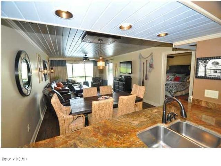 Located in a convenient, private area of Edgewater Beach Resort, Beach Villa 3103 is the essence of luxury.  This ground level Condo has been completely remodeled and professionally decorated.  The fully equipped kitchen boasts beautiful custom cabinetry and all stainless appliances.  A stackable washer/dryer unit is located in the pantry of the kitchen.  The dining area features a table hand-made from reclaimed wood built especially for this space.  Tongue and groove ceilings cover the living and dining area. Flooring is comprised of high end vinyl plank with a wood look, covered with wool rugs, to include a Persian carpet.  All rooms have black out drapes that were made to order.  The highlight of the Master Bath is a gorgeous walk in shower designed with imported Italian tile on the wal and river rocks on the floor.  All of the plumbing has been replaced.   Regular maintenance is scheduled on all appliances.  This Villa has access to a private beach gate and a pool located just a few steps from the front door.  All linens and contents of this one of a kind Villa convey with the unit. Edgewater Resort is the place to be on Panama City Beach!!  Amenities include: a par 3- 9 hole Golf Course, 3 basketball courts, tennis courts, a workout room, an impressive Lagoon pool located beach side in the complex, along with 7 pools on the Golf Villa side.