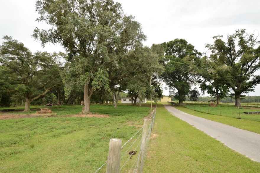 Property has been Dairy Farm, lots of road frontage on both sides of Creek 

Road. Property is fenced and crossed fenced with 25x60 milking parlor with 24x60 concrete area under barn. Additional equipment barn, grain bins, 45Kw generator that runs home and barns if power outage. 2 septic tanks 1 well. So much potential, could be Ag land, beef cows or several beautiful home sites. New Roof!!!