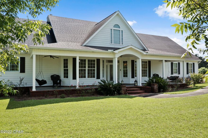 Enjoy country living at its best on this 24+/- acre estate! Follow the paved driveway lined with beautiful crepe myrtles to find this 4 bedroom, 2.5 bath custom home boasting over 3,500 square feet of living space.  Walk through the front door and you are immediately greeted with engineered hardwood floors, extensive crown molding, formal dining room, spacious living room with 14ft cathedral ceilings and wood burning fireplace. The eat-in kitchen is complete with custom cabinetry, breakfast bar, granite countertops, stainless steel appliances, double oven and island. Enjoy an abundance of space inside the master suite complete with his/her walk-in closets, double vanities, jetted tub and separate custom tiled shower with massaging jets. Other inside features include 3 spare bedrooms, oversized laundry room with an abundance of cabinetry and a 24x15 bonus room upstairs that could serve as a 5th bedroom. Spend time outside swimming in your saltwater pool, fishing in the fully stocked pond, sipping coffee from your screened in back porch or working inside your 24x48 barn. Home is located minutes to Hwy 79 and a short drive to Bonifay.