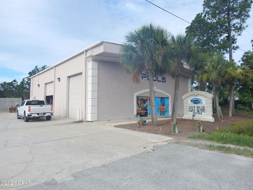 Great Location with 100 feet of Highway 98 frontage and almost 1/2 acres.  This property includes a large warehouse with 2 offices, bathroom, and a show room floor.  Currently operating as South Walton Pools. The large warehouse has two 15 foot wide roll up doors and abundance of storage etc. at 3876 square feet, and plenty of exterior parking  Great location for just about any business with highly visible free standing signage.  Great location between Panama City Beach and San Destin.    Value is based more on the Real Estate and not business.  Pool Business also for sale and can go with sale or without sale.