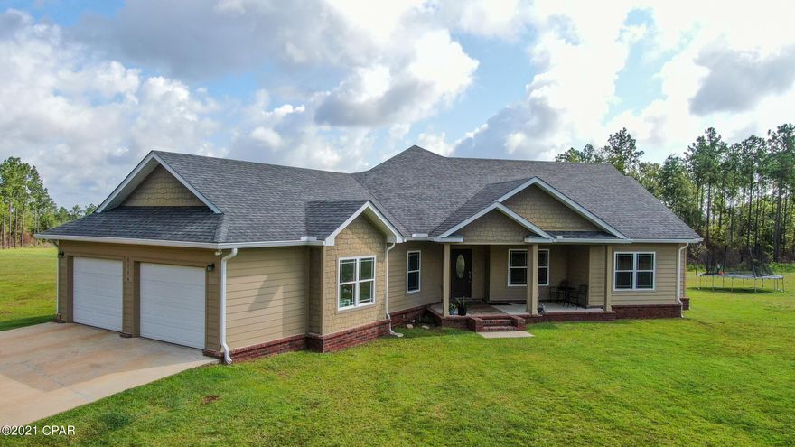 'CURRENTLY UNDER CONTRACT, SELLER ACCEPTING BACKUP OFFERS'

Rare find! This custom craftsman style home is a slice of paradise. If you long for the quiet and privacy of country living, but also enjoy the conveniences of living in the city, this may be it. This 3/3.5 open-concept split floor plan is situated to maximize the view of this expansive 20-acre property. Its brick and Hardie board exterior is durable and low maintenance. And large porches both front and back are perfect for entertaining or your outdoor lifestyle.

Inside you'll find top-quality finishes like wood plank and ceramic tile and quartz countertops. The 9-foot ceilings give an open feel and are trayed in the large family room. The kitchen is a dream come true for anyone who enjoys cooking. Features include; stainless appliances, gas cook top, double oven, hidden microwave, a prepping island complete with stainless sink and trash bin. Cabinets abound with many custom touches like vertical dividers for cookie sheets or shallow pans, deep pull-out drawers for even your largest pots. The kitchen also boasts a walk-in pantry.
The double-garage was built with trucks and boats in mind. It is a full 20 feet deep. The current owner has room for freezers and his boat with room to spare. The wide driveway extends beyond the 2 garage doors providing ample parking for a growing family.
Located only 2.5 miles from Hwy 77 in Wausau and north of Econfina Creek Water Management Area.
8 minutes to Dollar General
16 minutes to Walmart (Chipley)
16 minutes to Boat Lake
Less than 10 minutes to Sunny Hills Golf Club