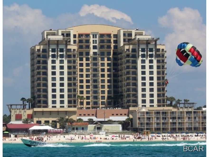 This fully furnished, rental ready studio is most affordable way to accommodate four in luxury at the beach with a King bed and Queen sleeper sofa! Enter thru the African Mahogany entry door to a tiled foyer bordered by a kitchenette and private full bath. Kitchenette has solid wood raised-panel cabinetry, a sink, cook top and vent hood, under counter refrigerator, and large china cabinet for added storage. If you haven't seen Origin yet, you've missed one of the best built condos in Panama City Beach! No other resort condominium in this market features hotel design cues...a large entrance motor court, luxurious remodeled lobby, and interior corridors with African Mahogany entrance doors and custom logo sconces. Sunrise and Sunset Terraces on the 15th floor are perfect for your reception or special event. Your family will love the Bamboo Room Theater, Grand Pool Terrace with heated zero-entry pool and hot tub, dining terraces with commercial stainless grills, and the convenience of in building parking and available onsite rental management. Perfect location steps from Gulf World, Sharky's, less than a mile from Pier Park, Frank Brown Park and convenient to Northwest Florida Beaches International Airport. ALL INFORMATION CONTAINED HEREIN IS DEEMED RELIABLE, BUT NOT GUARANTEED. SUBJECT TO ERRORS, OMISSIONS, PRIOR SALE, CHANGES OR WITHDRAWALS WITHOUT NOTICE.