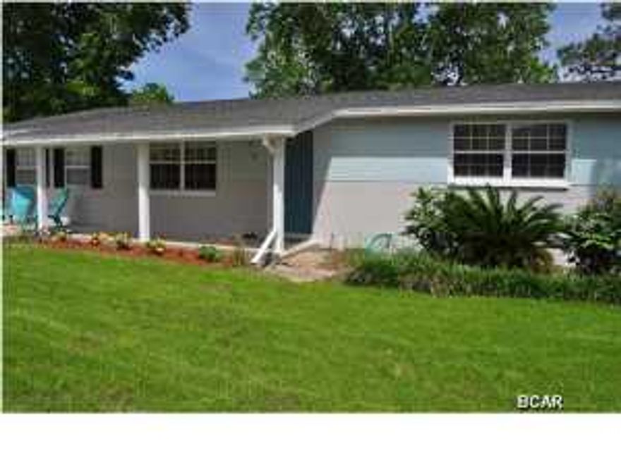 Charming Florida style cottage that's pretty as a picture and move-in ready! The sellers have renovated the interior in recent years; the flooring is all ceramic tile, new lighting and windows and the kitchen has been totally transformed with new counters, cabinets, back splash and appliances. The home has a split-bedroom floor plan and the 3rd (and largest) bedroom includes a walk-in closet. The back of the home includes a cozy sunroom overlooking the attractive and green backyard. Speaking of the yard, the lawn is well-maintained and there is a storage building for your lawnmower and beach gear. You're just around the block from a community park and mere minutes from the beach and Pier Park! All info is approx. and must be verified by Buyers if important.