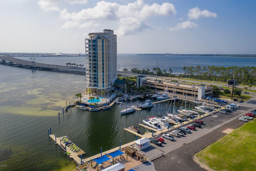 Luxury Condominium with remarkable views of St. Andrews Bay.  Tall energy efficient windows in each room give the feel of being singularly suspended on top of the water and shows a high standard of what waterfront living can be.  Zero entry pool overlooking the bay or marina with open deck for sunbathing or distancing.  A well appointed waterfront exercise room and community room are at your fingertips.  This two bedroom two bath is set up to accommodate a dual master situation.  Double vanity bathrooms, walk in closets, privacy each with views and access to the balcony.  Granite counters and stainless appliances, plenty of cabinets, a kitchen island that allows you to look at the water while working in the kitchen and a snazzy breakfast bar.  An external storage closet and parking space.