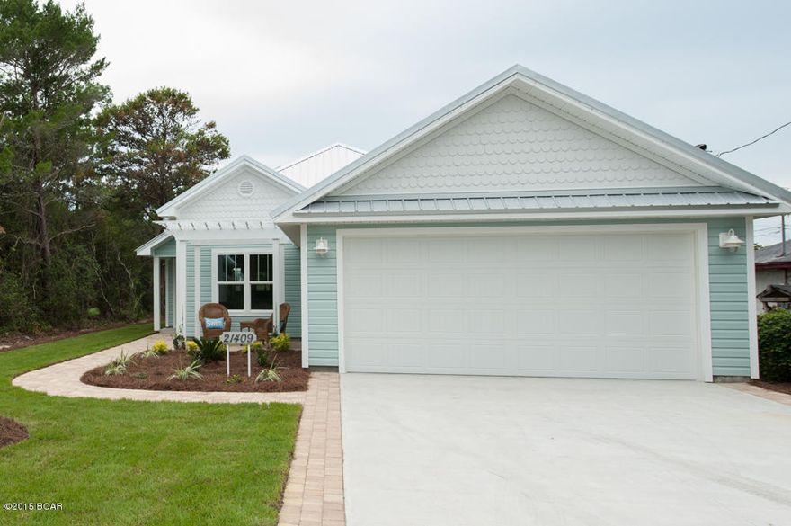 This gorgeous Beachy style home ombines all the modern amenities with just a bit of 60's Retro flair and many nice upgrades you'll typically see only in high end custom homes. Designed and built by Koehnemann + Gibbs, the beach's leading custom home builder, quality, craftsmanship and value-engineering are ingrained throughout. 

Every designer touch has been in- corporated into this home; offering soft and light paint colors, upgraded coastal cabinetry, unique crown moldings, accent painted interior doors, and beautiful fixtures.  This home is warm and inviting yet fun and casual.  And it feels much bigger than its 1436 square feet because of the thoughtfully designed open floor plan with high ceilings and lots of natural light. The well-planned kitchen is highlighted by gorgeous quartz counter-tops, with coordinating glass back splash and Whirlpool EnergyStar stainless steel appliances.  Double Master Bath vanities and beadboard wainscot finish off the bathrooms.
Some of the premium Energy-Efficiency features include Solar-Shield roof decking over the garage, Icynene spray foam insulation over the living spaces, Low-E window and door glass, a 15 SEER Trane heat pump, and a General Electric heat pump water heater! There's a fully landscaped and sodded yard with full coverage irrigation system. The hurricane resistance system includes Tie-Max all-thread rods, impact-resistant windows, and screw-down metal roofing with self-adhesive underlayment.
And don't forget the two huge storage attics!!  One over the garage, and one conditioned attic over the living area for seasonal or long term items!  Storage spaces galore!
Great Home!  Great Price!  Awesome Location!