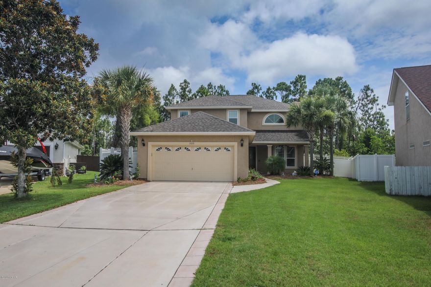 **Least expensive 2200 plus square foot pool home on the market!!** This is a wonderful home located in gated Dolphin Bay.  Dolphin Bay is a gated community featuring tennis courts and its own Marina.  This home can come with its own boat slip for an additional price. This 4 bedroom 2.5 bath home is situated on a quiet cul-de-sac with an oversized fenced lot.  The home features new porcelain ''wood look'' plank tiles, upgraded kitchen with quartz countertops, 20 foot plus ceilings in the great room, large screened in pool, fenced back yard with numerous fruit trees, brand new roof, brand new windows installed in May ($20k), brand new 7 foot tall vinyl fence ($10K) and a brand new $3500 front door.  This wonderful home is located only minutes to the World's Most Beautiful Beaches.