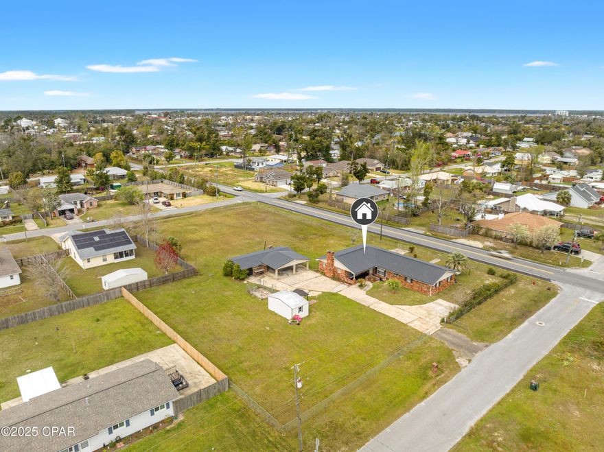 **LENDER INCENTIVES: Closing cost credit and/or rate buy-down available from preferred Lender. Contact Listing Agent for more information.**

Looking for space, comfort, and a prime location? This home offers over 2,400 square feet of living space on a generous 1.2-acre lot, providing plenty of room for indoor and outdoor living. With three bedrooms and two bathrooms, this home is perfect for those who need room to grow, work, or entertain.
Imagine spending time on the large covered porch, hosting guests, or relaxing in your backyard. The property's spacious layout is complemented by ample parking and a shed/workshop for extra storage or hobbies.
Lynn Haven is a wonderful place to call home for those seeking a peaceful community with proximity to the beautiful Gulf Coast, outdoor activities, and a wealth of local amenities. Whether you're starting a new chapter in life or looking to enjoy a more relaxed lifestyle, Lynn Haven offers a welcoming environment with everything you need nearby.
If you're looking for a property with space, flexibility, and a central location, 905 E 12th St is the perfect fit. Contact us today to schedule a showing!