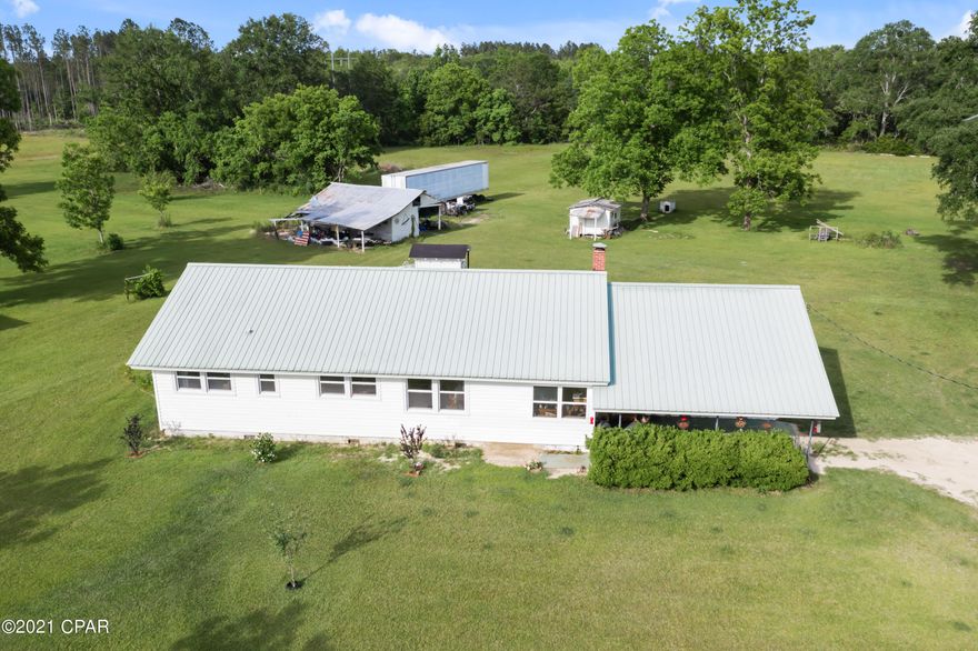 Currently under Contract. Seller taking Back Up Offers. Country living but close to town. Older home with updates. 4 bedrooms and 2 baths. Owner has taken down walls and opened up living, dining and kitchen into one large space. Property has 2 ponds , fruit trees and lots of space for animals. Owner is working on projects at this time. All this on 25 acres close to town.