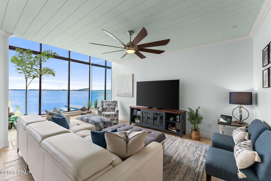 Beautifully Updated Bayfront Residence With Dedicated Boat Slip & Lift with immediate deep water access...Waterfront living at its finest! This updated bayfront property offers spectacular views of St. Andrews Bay and includes a dedicated boat slip with a 15,000-lb lift—an exceptional feature for boating and fishing enthusiasts.
Interior highlights include premium granite countertops, custom new cabinetry, modern stainless steel appliances, two fully updated baths, elegant travertine flooring, dual newly installed water heaters, shiplap accents, and a decorative wood ceiling. Floor-to-ceiling waterside solar shades with remote control enhance comfort while preserving the stunning views.
The primary bedroom overlooks St. Andrews Bay, offering peaceful water views to begin and end each day. A versatile third room, currently used as a THIRD Bedroom, also makes the perfect office, guest space, hobby room, nursery...you name it.
HOA covers water, sewer and trash.
Prime location just minutes to Historic St. Andrews, Downtown PC, Navy Base (NSA), Tyndall AFB, and area beaches.
Bayfront, upgraded, and move-in ready with outstanding access to boating and the outdoors!  If measurements deemed important, please verify.