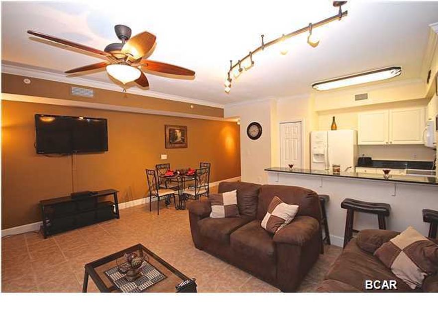 Don't miss out on this pristine 2BR/3BA unit. Unit 2413 features matching tile throughout the whole unit, black out curtains, upgraded light fixtures and granite countertops in the kitchen. This unit is priced to sell and will not last long. Tidewater is known for having one of the best locations in PCB and offers tons of amenities that everyone can enjoy. Tidewater features 636 ft of Gulf frontage, a large fitness center, saunas, steam rooms, an owners lounge, two game rooms, a large movie theater, a restaurant, a tiki bar, convention/conference room, covered parking garage, covered sky walk, two outdoor pools, one indoor heated pool, four hot tubs, security and a market that sells Starbucks coffee, ice-cream, beach toys and more! This unit is priced to sell and will not last long