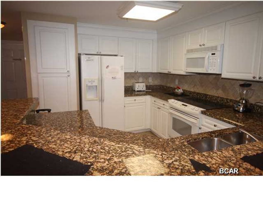 New cabinets just installed!! This is the much desired BB floor plan with two bedrooms and a bunk room. This is a 12th floor unit that is low enough to enjoy the view and high enough to avoid the pool noise. Boardwalk is considered by most to be one of the top three Gulf Front complexes. This complex is loaded with amenities and features a zero entry pool. The amenities including covered parking, fitness center, meeting space, kids club, hot tubs, interactive child area, tiki bar and restaurant. All information is believed to be correct but should be verified by the buyer.