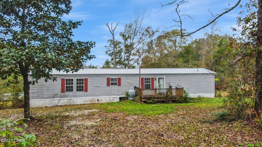 PRICED TO SELL!!! Check out this adorable, recently remodeled manufactured home on almost an acre on a pond in the Vernon area. Close to the beach, great commute to west end and even to Santa Rosa! This 3 bedroom, 2 bath home has had a wall removed between the 2 spare bedrooms, and is currently a 2 bedroom. HOWEVER, put the wall back up and you're back in the 3 bedroom business!!! New kitchen! Updated vinyl/laminate plank flooring through much of the house. It's really, really cute! Located on a pond! (all sizes approximate and taken from public records, buyers please verify any details you deem important)