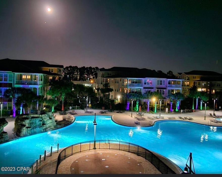 'CURRENTLY UNDER CONTRACT, SELLER WILL CONSIDER BACKUP OFFERS'.  Breath taking views of the island style lagoon pool with relaxing waterfalls from this spacious wrap around patio!  Beautifully updated condo with modern and stylish features.  When you step into the automatically lighted foyer and hallway you will immediately notice the wainscoting, a modern half bath, and wonderful laundry area with wood shelving. The kitchen island bar is accented with ship-lap giving that coastal feel in addition to the plantation shutters in the living room. In the kitchen you will be glad to find wood pull out cabinet drawers, soft close doors, all newer appliances and sink as well as garbage disposal.  Most light fixtures have been modernized.  Bathroom mirrors have  been accented beautifully with wood, master bedroom closet has professional wood shelving as well.  Easy condo living at its best.  And oh the amenities!  Everything you need at Island Reserve from the acre island pool, hot tub, indoor basketball/pickleball court, modern fitness center, game/community room & theater room.  Under 2 miles to the beautiful sandy beaches!  And, bring your golf cart.   Fantastic social functions for the residents.  Get to know your neighbors and have fun and enjoy.  Elevators in all buildings.  Furniture can be negotiated. NO SHORT TERM RENTALS.