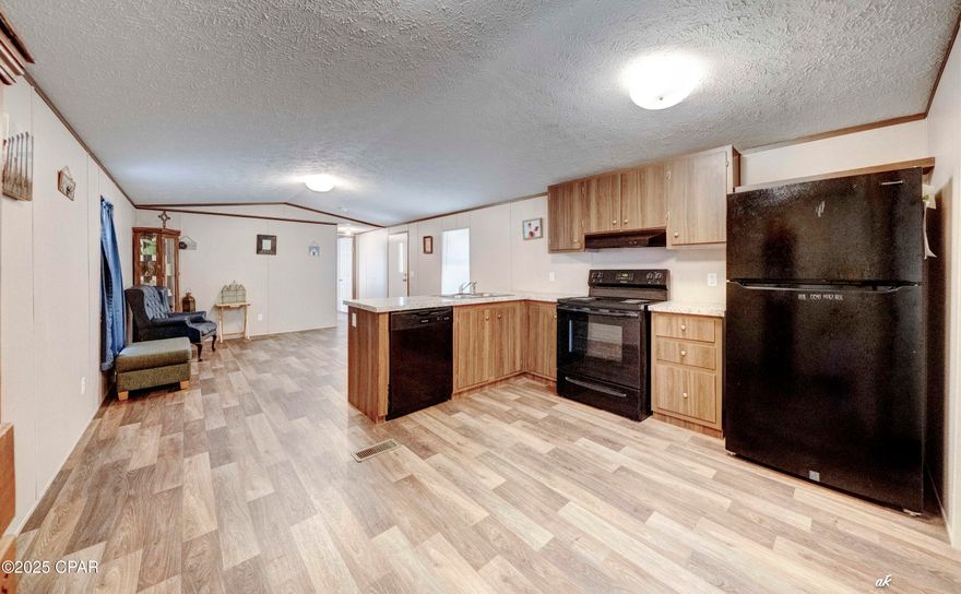 Welcome to this beautifully maintained, modern 2-bedroom, 2-bath single wide mobile home built in 2022 is perfectly situated at in the serene area of Fountain, FL. Positioned just 30 minutes north of Panama City, its convenient location also offers a quiet, country secluded feel while being easily accessible to all the area has to offer. 

Step inside to discover a clean and open floor plan featuring spacious living areas, a well-appointed kitchen with ample cabinet space, storage and sleek finishes throughout. The split floorpan offers sizable bedrooms with generous closet space and privacy, complemented by two full bathrooms designed for convenience and comfort.

Enjoy the peaceful surroundings and the ease of maintenance that comes with a newer home. Whether you're a first-time buyer, downsizing, or looking for a cozy getaway, this property offers the perfect blend of comfort, functionality, and modern living.

Don't miss your chance to own this move-in ready gem in a tranquil location—schedule your showing today!

-Located in flood zone A but have Elevation Certificate on file. 
-Boundary Survey on file.

*Please note, the drop in gate off of the back porch does not convey in the sale.

**Buyer to verify all measurements and information, if important.