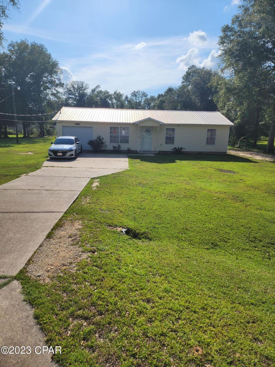 Very nice home in Greenwood, Fl. This home was renovated in 2019. It has an open floor plan design with a spacious living room and a new kitchen with beautiful granite countertops and stainless appliances.  There are three nice sized bedrooms. The master bedroom has its own bathroom with a large tiled shower.  There is a large laundry off of the living space that also opens up the single car garage.  The home sits on a half acre lot that is cleared and wide open for the kids to play. It is also located within walking distance to the city park/playground. Marianna schools are located less than 8 miles away for easy access.