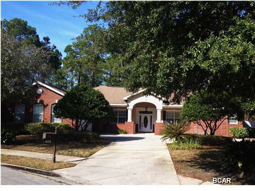 **OPEN HOUSE SUNDAY, JAN. 25 1:00-3:00** Unique, Elegant home in the lovely/convenient WOODRUN neighborhood has something for everyone! Gorgeous Crystal chandeliers and the custom Tuscan finishes make this home look like something from a magazine; yet, the generously-sized rooms and comfortable floor plan are practical for both entertaining and daily living. As you enter the home, you will admire the beautiful millwork (extra-wide baseboards, layered crown molding), spectacular light fixtures, and glossy hardwood flooring of the Formal Living and Dining Rooms. You can entertain your guests in front of the cozy gas fireplace or work from home in the adjacent Home Office (complete with wonderful built-in shelving). Double doors from the Living Room lead into the sumptuous Master