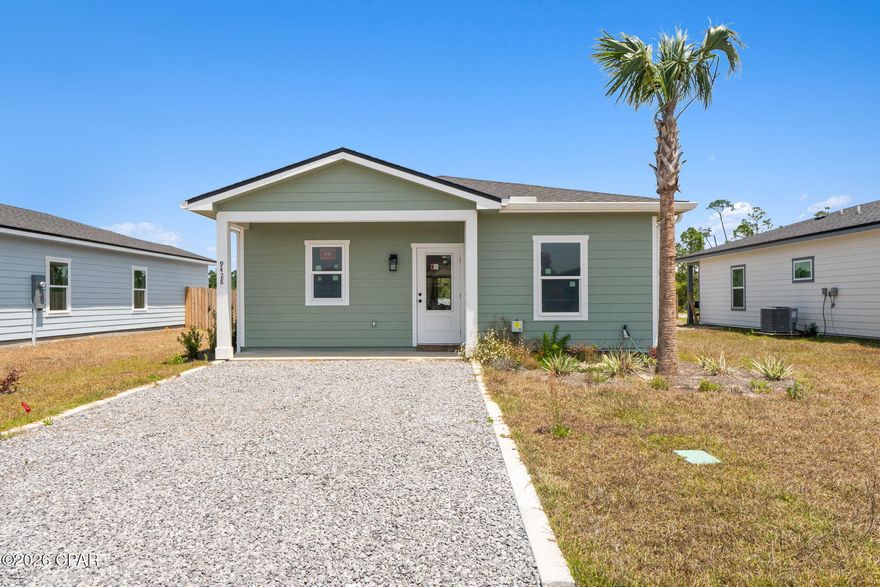 Easygoing coastal lifestyle meets modern comfort in this brand-new, move-in ready 3-bedroom, 2-bath home, perfectly tucked away on a quiet street just a short golf cart ride from beach access. Start your mornings with coffee on the patio, then head out for a full day of sun, sand, and salt air just minutes away. Step inside to a bright, open-concept layout designed for both everyday living and effortless entertaining. With 9-foot ceilings, abundant natural light, and a seamless flow from the living room to the kitchen, the space feels open and inviting. The kitchen stands out with quartz countertops, soft-close shaker cabinetry, stainless steel appliances, and an oversized island--perfect for gathering after a long day at the beach. The primary suite offers a peaceful retreat with a walk-in tile shower, dual vanities, and custom wood shelving in the closet, while two spacious guest bedrooms provide plenty of room for family and friends. Quality craftsmanship shines throughout with thoughtfully selected finishes that elevate the home beyond the expected. Step outside to a covered back porch and private fenced backyard, ideal for grilling, entertaining, or unwinding at the end of the day. Modern, energy-efficient features provide comfort and peace of mind. Living here means embracing the Forgotten Coast lifestyle--from beach days and boating to fresh seafood and laid-back evenings. Whether you're searching for a full-time residence, vacation getaway, or investment opportunity, this home delivers exceptional value. There's no time like the present to make dreams a reality. Come Live the Beach Life with us. Call today for more information.