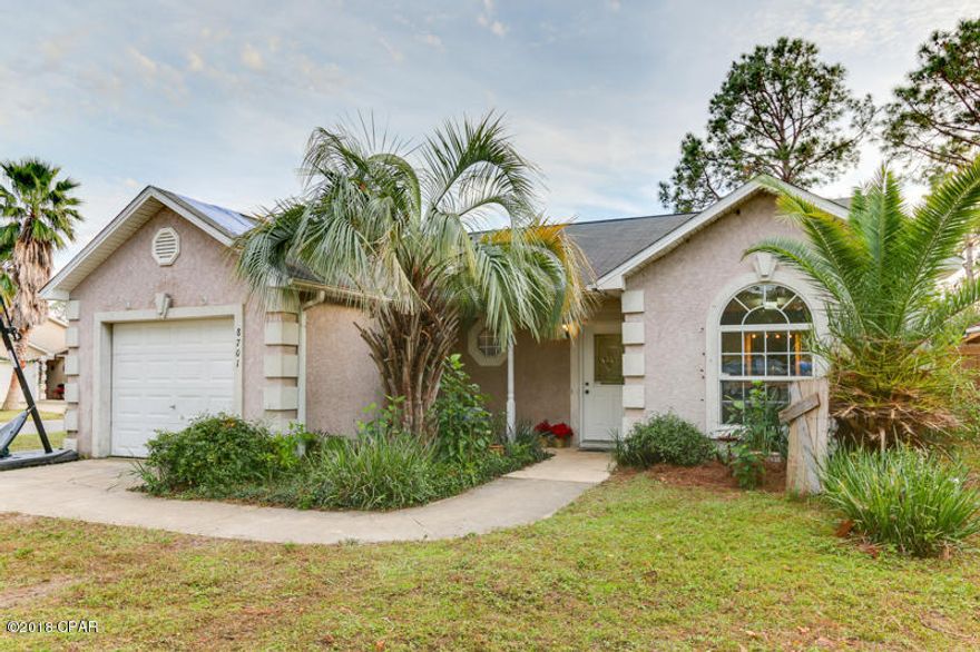 Must see!!! You will feel right at home the moment you walk in the door. This quality built 3 bedroom 2 bathroom home is perfect for first time home buyers or someone that is looking for a stress free environment close to the beach. This home has many updates, including a NEW ROOF, new fence and brand new flooring in the entryway, kitchen, living room, and hallway. This family friendly neighborhood is only a few minutes to the white sandy beaches. Also, conveniently located close to shopping, entertainment and popular dining experiences. Other highlights include a one car garage, corner lot, and fireplace. Perfect for entertaining guests or just relaxing with your family! You will also love relaxing in the screened in porch, while you watch your children play in the fenced in backyard. Do You will also love relaxing in the screened in porch, while you watch your children play in the fenced in backyard. Do not wait to call your real estate agent to schedule your private showing before it's too late!