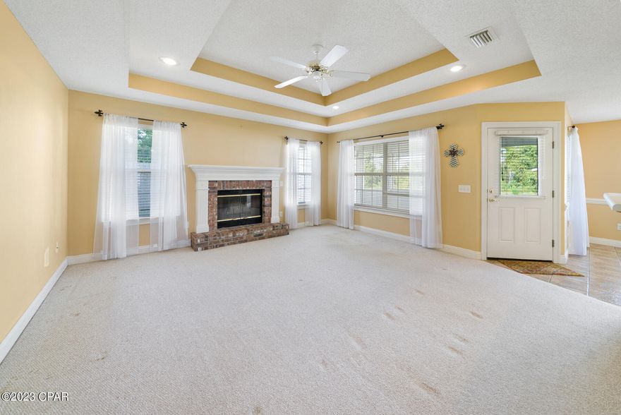 CURRENTLY UNDER CONTRACT, SELLER WILL CONSIDER BACKUP OFFERS. Nestled at the end of a serene cul-de-sac, this enchanting home encapsulates the essence of timeless charm and comfort. With its picturesque traditional exterior, this residence exudes a welcoming warmth that instantly makes you feel at home. Step inside to discover a world of elegance and practicality, with three inviting bedrooms and two thoughtfully designed bathrooms. Sunlight dances through every corner, casting a golden glow that highlights the thoughtful layout. The heart of the home is adorned with a wood-burning fireplace, perfect for cozy evenings spent with loved ones. The primary bathroom is a true oasis, boasting a double vanity, not one but two invigorating showers, and a luxurious jacuzzi tub—your personal retreat after a long day. Outside, a separate garage/workshop beckons to the hobbyist or artist within, offering insulation, A/C, and power for year-round creativity. This captivating home is more than just a dwelling; it's an opportunity to embrace a lifestyle of tranquility and inspiration. Embrace the allure of a simpler time and make this charming haven yours today.