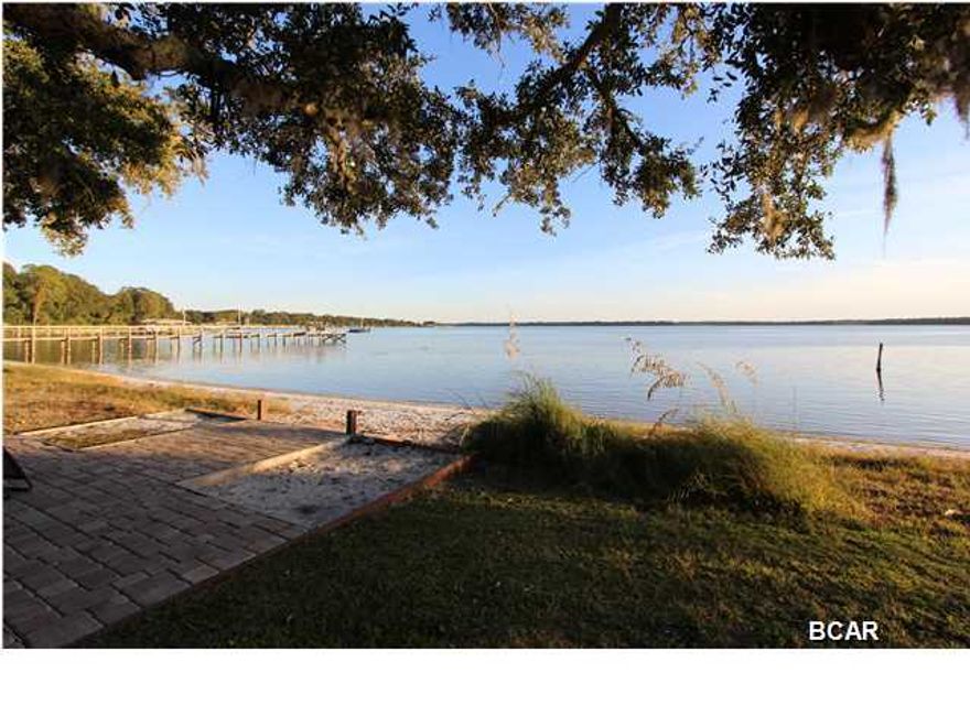 Looking for a home in a lovely waterfront setting, close to town but still with a quiet and private feel - well look no more - 300 Cherry Street Unit 8 is it! This unit has 3 large bedrooms with the master bedroom having it's own private balcony and a large walk-in closet, both of the secondary bedrooms are bright and spacious, 2.5 baths and an open concept living/dining/kitchen with views of St. Andrew Bay through the New double French doors and a New deck. While on the deck you can enjoy the views of the Bay or walk out to your own beach where you can participate in any number of water sports from kayaking, SUP'ing or pull your boat up and go! Imagine viewing the 4th of July fireworks right from your own backyard and you're within walking distance to Downtown, St. Andrews Bay Yacht