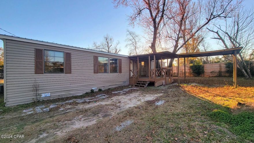 Ready for its new owner, this spacious doublewide offers a great location that's both convenient and quiet.  Split bedroom plan offers privacy and functional living.  The center of the home features a living, dining, and kitchen, with 2 bedrooms and bath at one end, and the master suite at the other.  New HVAC system and counters after Hurricane Michael.  Home sustained minimal damage and all repairs were made.