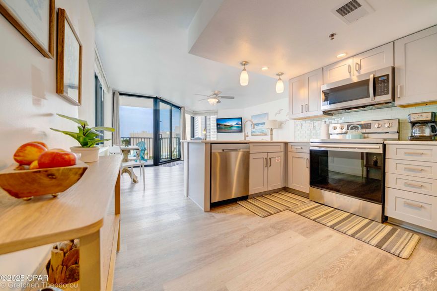Oh my: Just got word from Management company of the rental income for the year. Very impressive! Escape to a world of paradise in this exquisite Gulf-front condo that transcends the ordinary and encapsulates the essence of coastal living. Immerse yourself in the serene beauty of breathtaking sunsets and pristine beaches, all within the embrace of your own private oasis. This renovated condo including a one year old HVAC unit, seamlessly blends modern elegance with coastal charm, offering a lifestyle of relaxation and refinement. The open kitchen is adorned with sleek quartz countertops, beautiful gray soft-close cabinets, and a welcoming
breakfast bar perfect for gatherings. The details show not only in the beautiful cabinetry but also in the over the top stainless appliances and deep single bowl sink. Step into tranquility as you enter your private bedroom with access to your bath with a delightful vanity and newer tub, meticulously tiled with a touch of perfection. You also have another
access to not only a private owner's closet but into the main living area perfect for entertaining with views of the Beaches and the lights of Panama City Beach and its nightlife. Walk to Pineapple Willies, Walmart, Waffle House and a number of fast food and sit down
restaurants and soon... Tootsies, where the old iconic Spinnakers was located. There are three pools with one heated. The center pool has just been totally redone!  Call your favorite Realtor and come check out this condo!!
