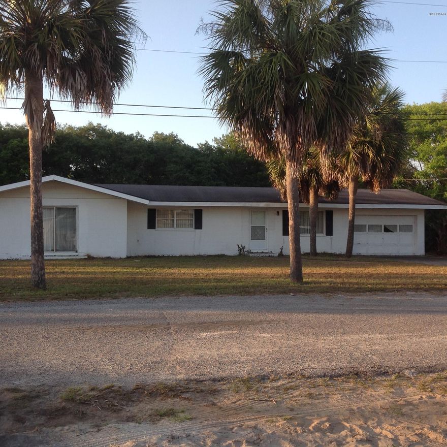 This prize property is one of the most desired constructions at the beach; ''the concrete block house''. It features a large concrete block storage building too. You just get in your golf cart and make your way around Azalea Drive to Twin Lakes right at the Front Beach Road. This property has endless potential.The 2 lots East of the house have been sold, the house sits on Lots 3 & 4 only.